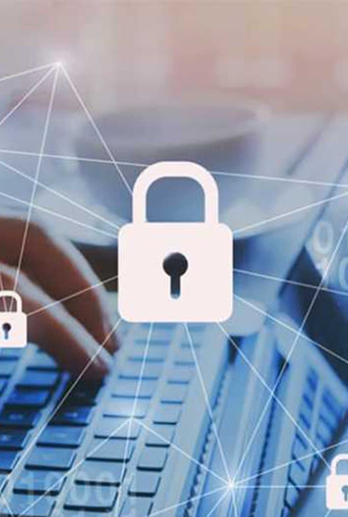 A padlock icon over a laptop keyboard, representing endpoint security
